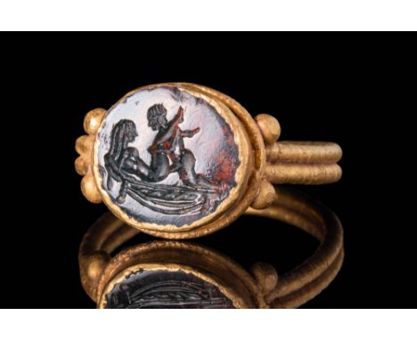 Ca. AD 100 - 300A Roman round jasper intaglio depicting an erotic scene. The design is made in stylised manner typical of the