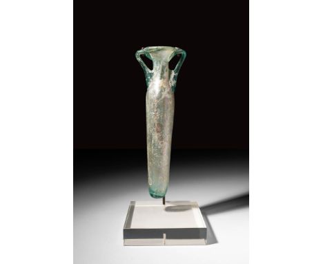 Ca. AD 300 - 500A marvellous Roman free-blown glass amphoriskos in blue-green glass. This example boasts thick flakes of irid