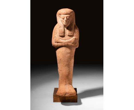 New Kingdom, Ca. 1190 - 1069 BCA remarkable Egyptian New Kingdom example of a terracotta ushabti. The figure stands in mummif