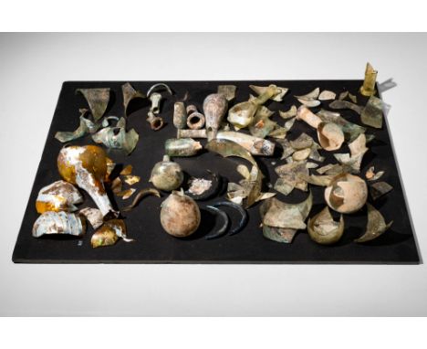 Ca. AD 100 - 500A large group of Roman glass fragments, including unguentaria in different shapes and colours and bangles fro