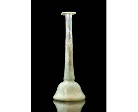 Ca. AD 100 - 300A Roman unguentarium formed from translucent green glass. It has a hemispherical body, a long, tapering neck,