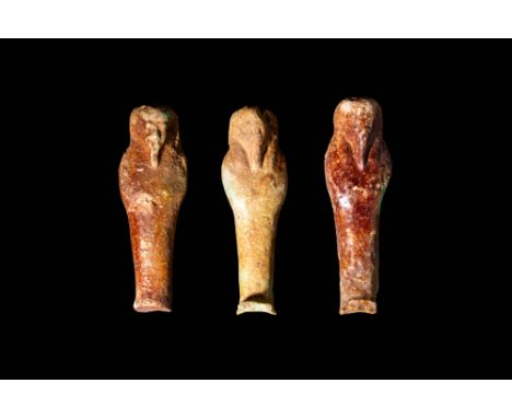 Late Period - Ptolemaic Period, Ca. 664 - 30 BCA set of Egyptian faience ushabti figures. The three figures stand in mummifor