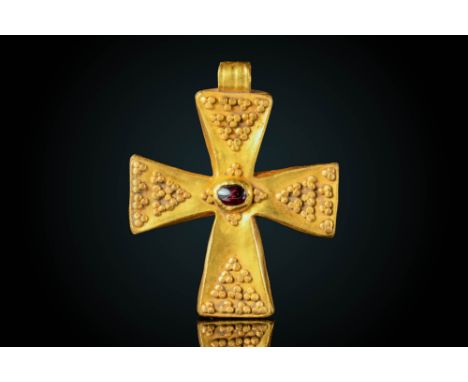 Ca. AD 500 - 600A stunning Byzantine bronze patent cross-shaped pendant decorated with gold pellet clusters on the arms and a
