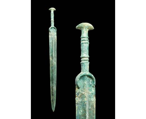 Ca. 1200 - 800 BC A Western Asiatic bronze sword with a long, tapering blade, a prominent mid-rib and a gracefully curved gua