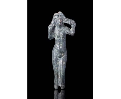 Ca. AD 100 - 300A Roman bronze statuette of goddess Venus standing with her weight on her left leg, her right leg bent at the