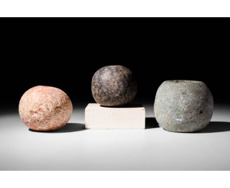 Ca. 3100 - 2900 BCA set of 3 Egyptian carved mace heads, each of relatively spherical form with a hole drilled bi-conically f