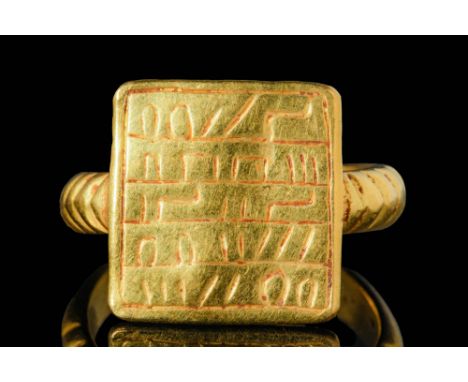 Ca. AD 100 - 300A Romano-Jewish gold ring with a round hoop with triangular section decorated with incised lines. The shoulde