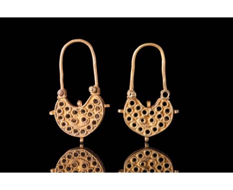 Ca. 700 - 500 BCA pair of Greek gold openwork lunar shape earrings composed of a main body decorated with gold threads to fra