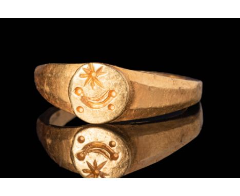 Ca. AD 200 - 300A Roman gold ring composed of a slender, angular hoop with a polygonal section. It has large flat shoulders w