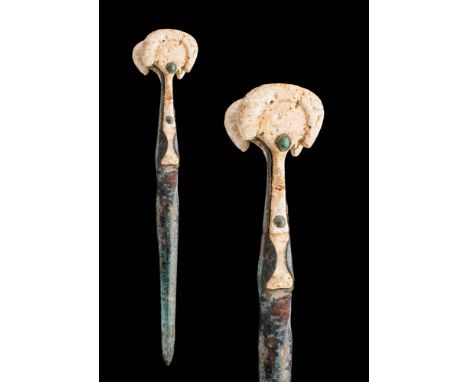 Ca. 1200 - 800 BCA Western Asiatic / Early Greek cast bronze dagger featuring an elongated double-edged blade and a slightly 