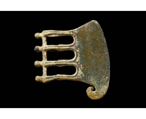 Ca. 1200 - 900 BC A Western Asiatic bronze openwork ritual axe head bearing a vertical short blade edge extending downward wi