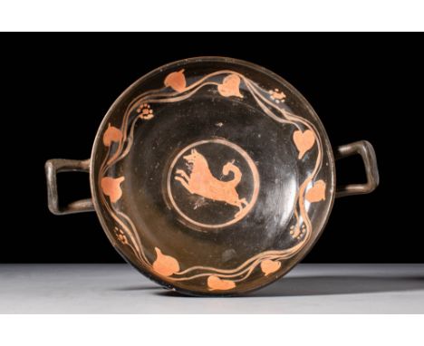 Ca. 400 - 300 BCAn Apulian kylix in the style commonly known as "Xenon ware." This exquisite drinking vessel features two rai