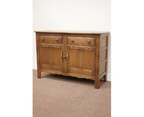 Ercol 'Mural' elm golden dawn sideboard fitted with two drawers and two cupboards below, W124cm, H83cm, D49cm Condition Repor