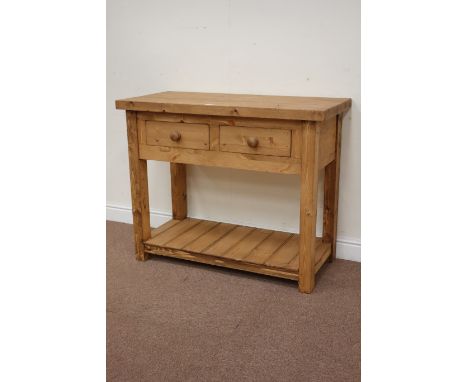 Pine server table, rectangular top over two frieze drawers raised on square legs united by shelf, with two baskets, W 105cm, 