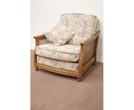Ercol 'Bergére' elm golden dawn armchair with upholstered loose cushions, W90cm Condition Report Click here for further image