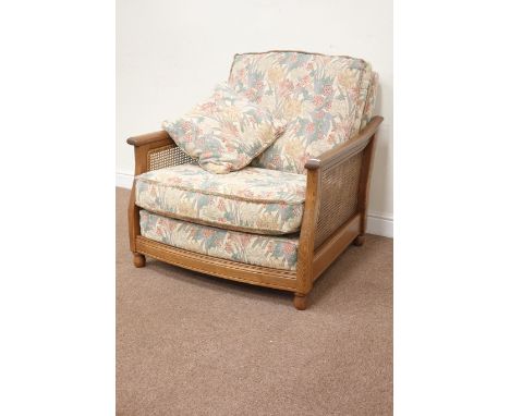 Ercol 'Bergére' elm golden dawn armchair with upholstered loose cushions, W90cm Condition Report Click here for further image