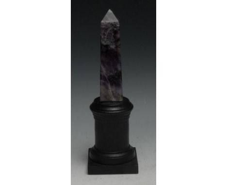 An amethyst quartz obelisk, mounted for the desk, turned plinth, 22cm high 
