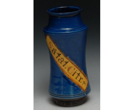 A Continental albarello drug jar, inscribed Dacty Li, within a yellow banner on a blue glazed ground, 21.5cm high, 19th centu