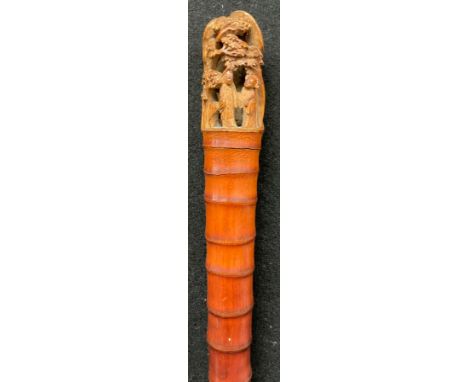A Chinese bamboo walking stick, the pommel carved in the Cantonese manner with figures amongst blossoming prunus, 94.5cm long