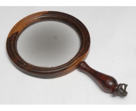 A 19th century lignum vitae connoisseur's lens, circular magnifying glass, turned handle with brass axehead finial, 22cm long