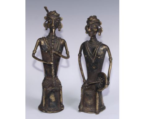 A pair of Indian Dhokra figures, cast as Hindu musicians, 31cm and 28.5cm high, West Bengal, first half 20th century 