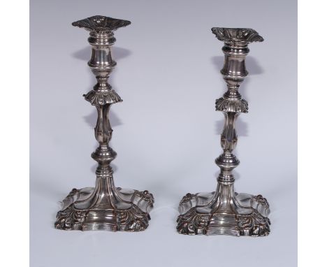 A pair of Old Sheffield Plate table candlesticks, knopped pillars, shells to angles, 23.5cm high, crested, c.1830 