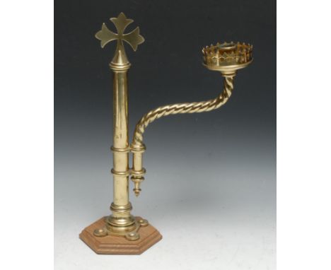 A Gothic Revival brass pulpit or lectern candlestick, the sconce and spiral branch adjustable on a swivel, cross finial, hexa
