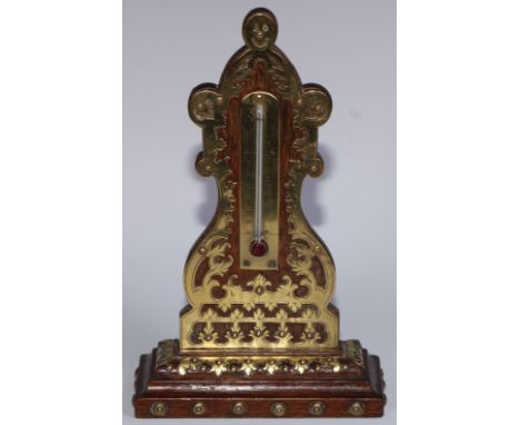 A 19th century oak desk thermometer, applied overall with brass cut-card work, 22.5cm high, c.1870 