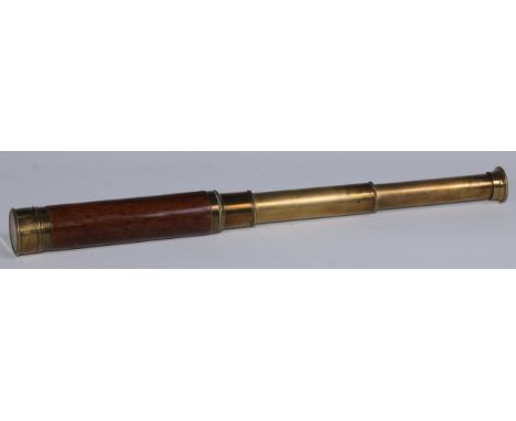 An early 20th century brass and mahogany two-draw pocket telescope, aperture cover to eyepiece, brass lens cap, 18cm extendin