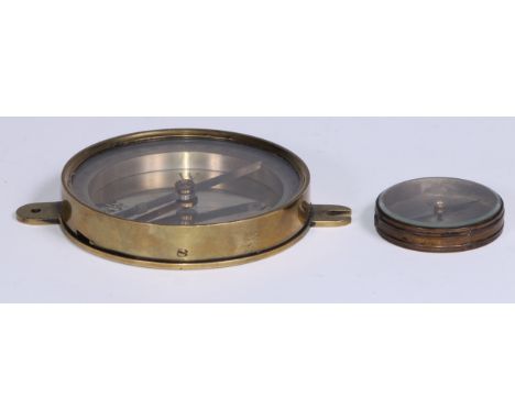 A 19th century brass compass, 8.5cm silvered dial engraved with fleur-de-lys, lockable needle, 12cm wide overall; a pocket co