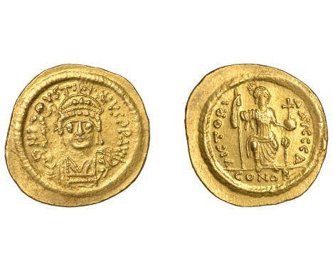 Justin II, Solidus, Constantinople, first officina, crowned bust facing, holding globe surmounted by Victory and shield, rev.