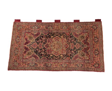 Isfahan Rug Central Iran, circa 1910 The deep indigo field of vines around a flowerhead medallion framed by crimson floral sp