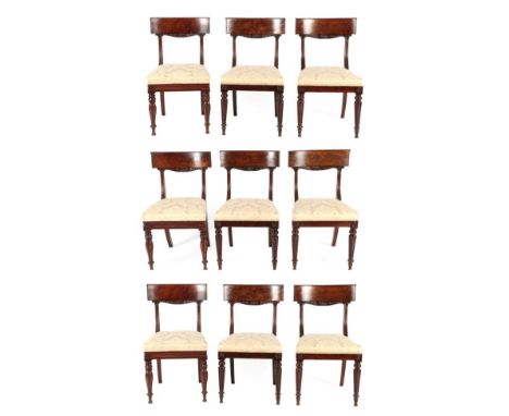 A Harlequin Set of Nine Mahogany Dining Chairs, circa 1840, comprising six with curved back supports above reeded uprights, r