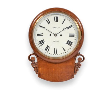 An Oak Striking Drop Dial Wall Clock, signed Leffler, Bristol, circa 1870, side and bottom doors, carved scroll and floral ''