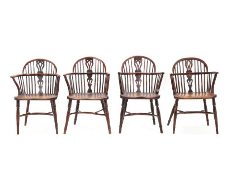 A Matched Set of Four Mid 19th Century Yewwood Spindle Back Windsor Armchairs, Nottinghamshire region, each with double spind