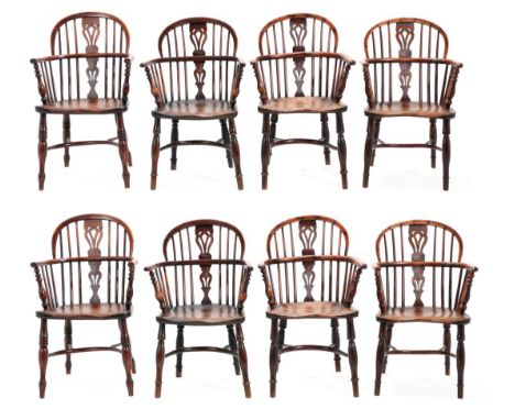 A Matched Set of Eight Mid 19th Century Yewwood and Elm-Seated Windsor Armchairs, one stamped Nicholson Rockley, each with lo