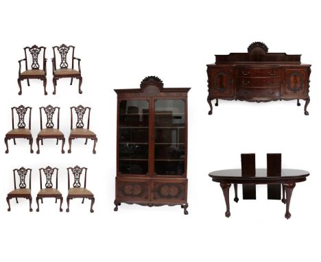 An Eleven Piece Carved Mahogany Dining Room Suite, late 19th/early 20th century, comprising an oval extending dining table, w