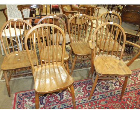 A set of four stained elm and beech hoop-back chairs and two other stick-back chairs, (6).