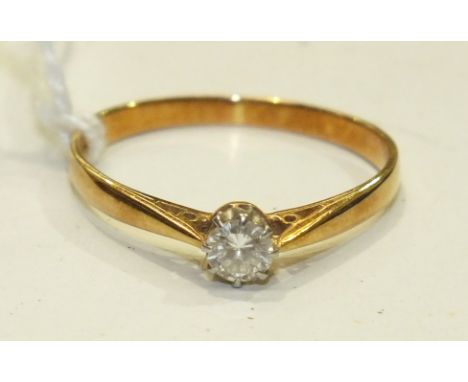 A solitaire diamond ring, the brilliant-cut diamond of 0.2cts in 18ct yellow gold and platinum mount, size Q½, 2.1g.