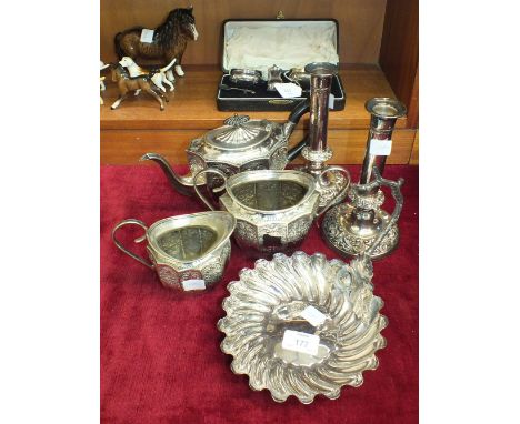 A cased silver three-piece cruet set, Birmingham 1923, ___3oz, a three-piece plated tea service, a pair of plated candlestick