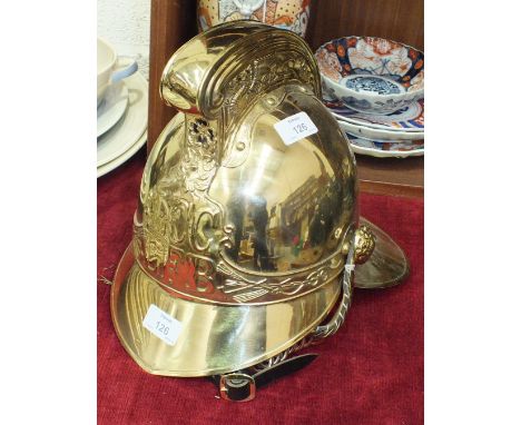 A reproduction fireman's brass helmet.