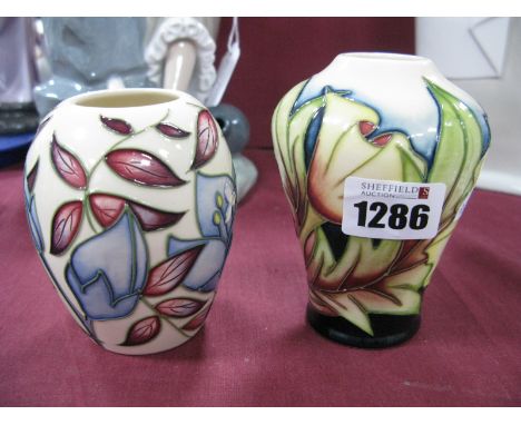 A Moorcroft 'Jacobs Ladder' Vase, of ovoid form, by Alicia Amison, Collectors Club?, 2004, 9.5cm high; and a further floral v