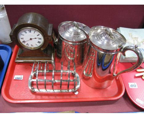 An Edwardian Mahogany Mantel Clock, white enamel dial, Roman numerals, labelled Brovington, a six bar plated toast rack, Walk