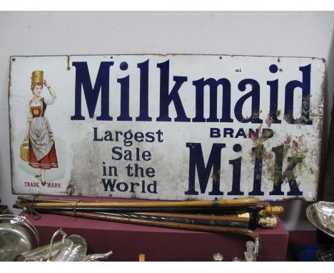 A 'Milkmaid Milk Board Largest Sale in The World' Enamel sign 56 x 123cm