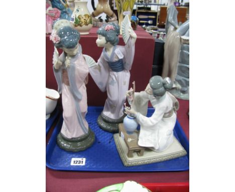 Three Lladro Geisha Models, including "Geisha Arranging Flowers., 4840, "Abanico" 4.991, and "Geisha with Fan" (all boxed). (
