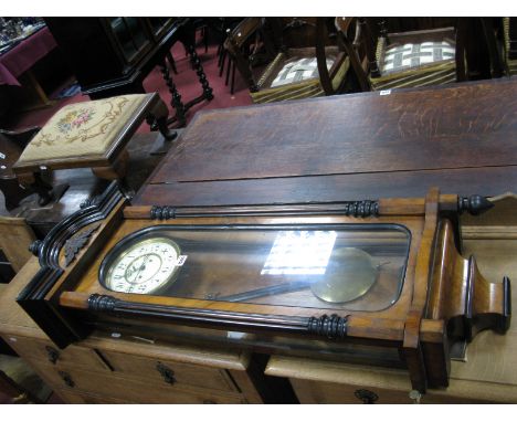 A XIX Century Walnut Vienna Wall Clock, with turned finials to arched top, half round column supports, enamel dial, minute di