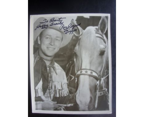 Roy Rogers Signed Cowboy Photo: Large black and white original photo picturing Roy with Trigger dedicated "To Bert Happy Trai