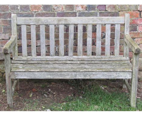 A vintage weathered teak two seat garden bench with slatted seat and back (af), 120 cm wide 