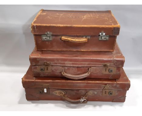 Three small vintage brown fibre and leather reinforced suitcases, the largest example 60 cm x 35 cm x 16 cm high 
