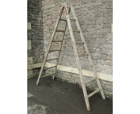 A vintage weathered/scrubbed pine 'A' framed folding decorators step ladder, 230 cm high (to be sold for display purposes onl